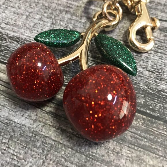 Coach Glitter Cherry Keychain with Gold and Green Accents - Picture 5 of 6